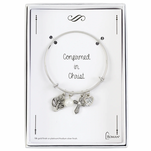 Silver Confirmation bracelet with charms on a branded card