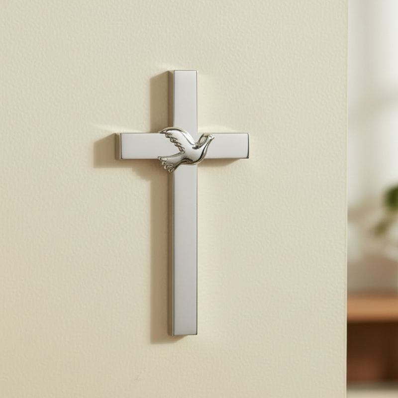 Confirmation wall cross with a silver finish hanging on a beige wall.