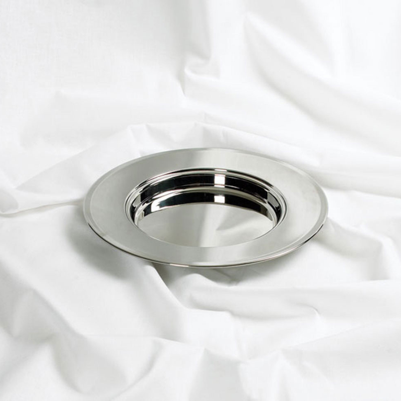 Silver dish on a white fabric background