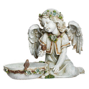 Statue of an angel with wings and floral crown holding a bird, on a white background