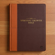 A two-tone espresso and toffee brown faux leather Bible with the title 'The Spiritual Growth Bible' in large gold-foiled letters on the front cover.