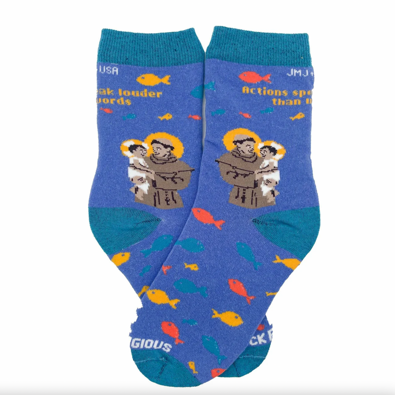 A pair of kids' socks with colorful designs and an image of St. Anthony of Padua holding the Christ Child