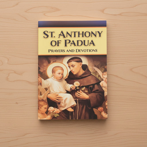 Book titled 'St. Anthony of Padua: Prayers and Devotions' on a wooden surface