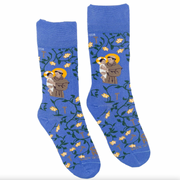 A pair of blue socks with a design featuring St. Anthony holding the Infant Jesus, surrounded by a floral pattern.