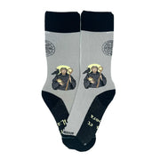 Gray socks with St. Benedict design on a white background