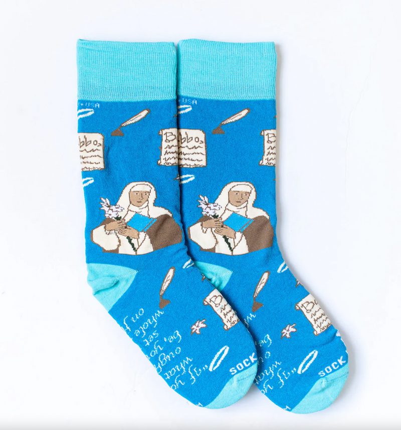 A pair of blue socks with a design featuring St. Catherine of Siena and religious symbols.