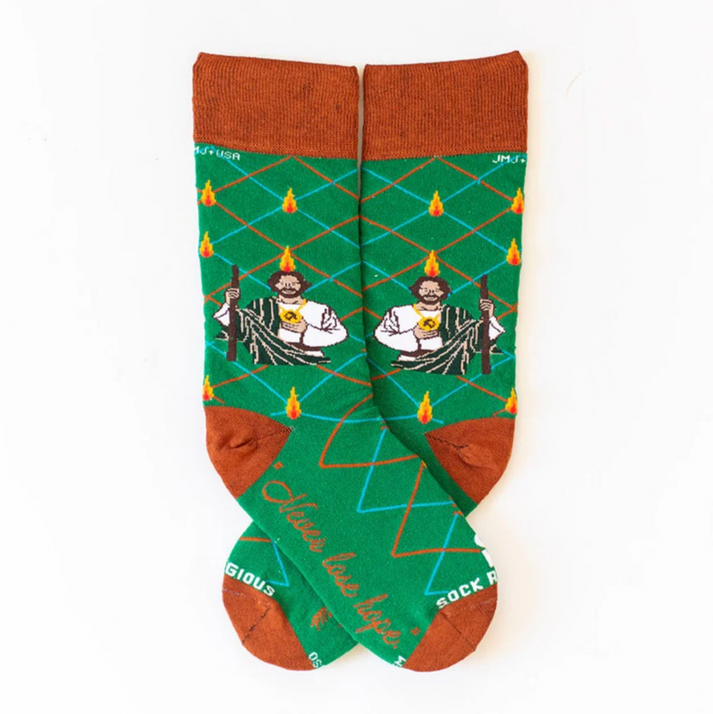 Vibrant green socks with an image of St. Jude on a white background