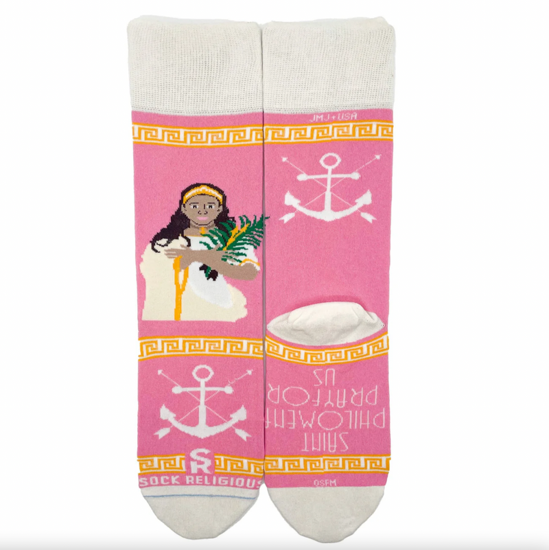 Pink and gold socks featuring an image of St. Philomena holding a palm branch on a white background