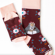Burgundy and pink floral crew socks with an imagine of St. Rose of Lima.