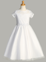 A white lace First Communion dress with a sweetheart neckline on a gray background