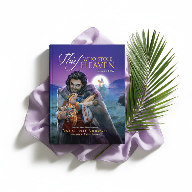 Book titled 'The Thief Who Stole Heaven' by Raymond Arroyo on purple fabric with a palm branch.