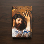 Book cover of 'The Way' by Josemaria Escriva on a wooden surface