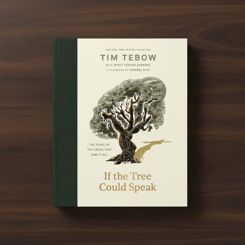 Book titled 'If the Tree Could Speak' by Tim Tebow on a wooden surface