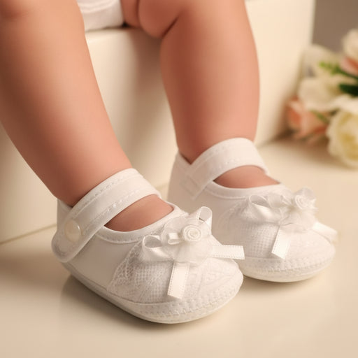 White baby shoes with bows in a Baptism setting