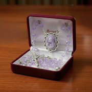 Pale purple glass rosary with a madonna cameo centerpiece