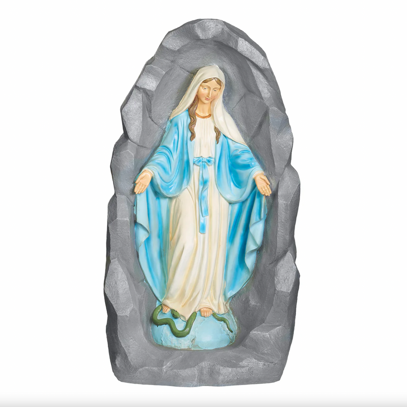 Statue of the Virgin Mary in a rocky background