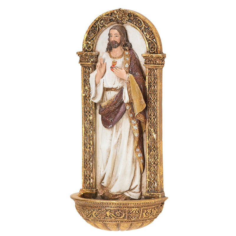 Decorative holy water wall font of the Sacred Heart of Jesus in a gold frame on a white background