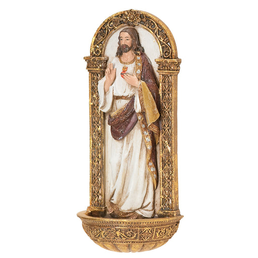Decorative holy water wall font of the Sacred Heart of Jesus in a gold frame on a white background