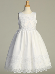 White lace dress on a mannequin against a gray background