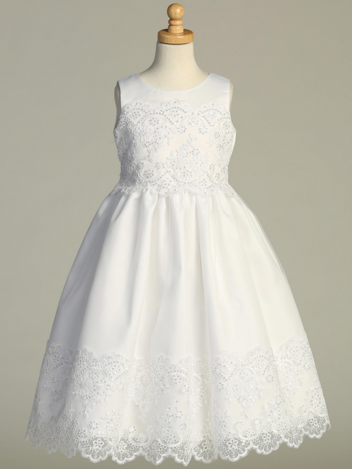 White lace dress on a mannequin against a gray background