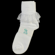 White ruffled First Communion sock with an embroidered cross on a white background