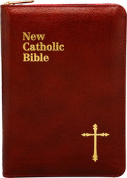 Red leather-bound Bible with gold text and cross on a white background