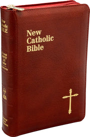 Red New Catholic Bible with gold text and cross on a white background