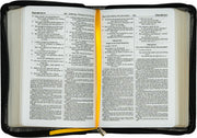 Open Bible with a black cover and yellow bookmark