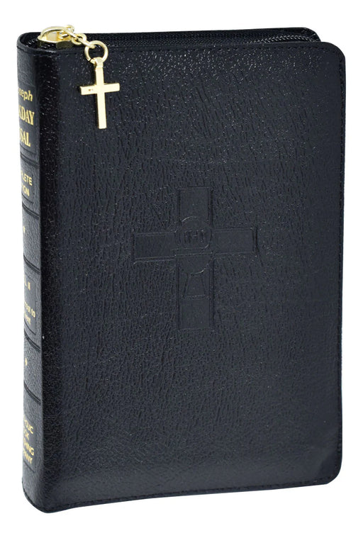 Black leather-bound missal with gold cross on a black background
