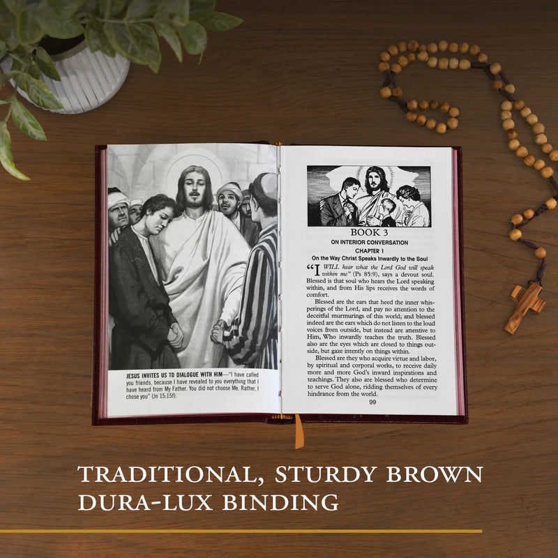 Open book with religious illustrations on a wooden surface, accompanied by a rosary.