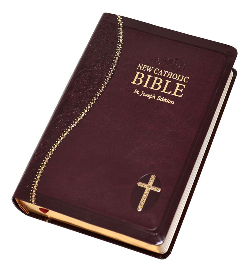 Burgundy and gold Bible on a white background.