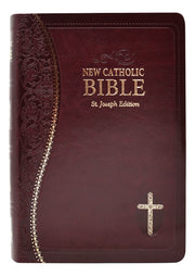 Burgundy and gold Bible on a white background.