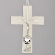 Silver and pearlized look First Communion cross on a gray background.