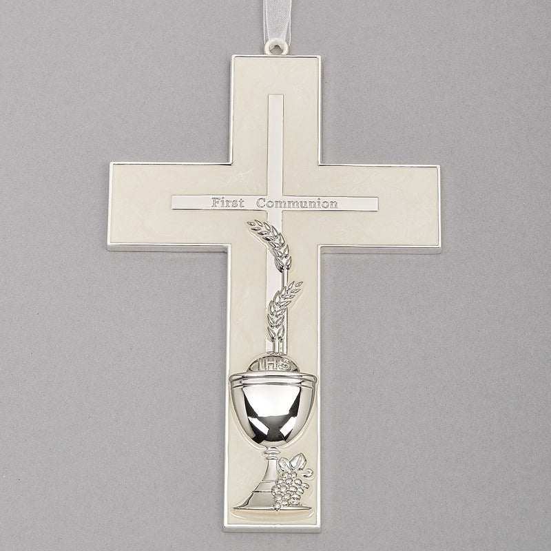Silver and pearlized look First Communion cross on a gray background.