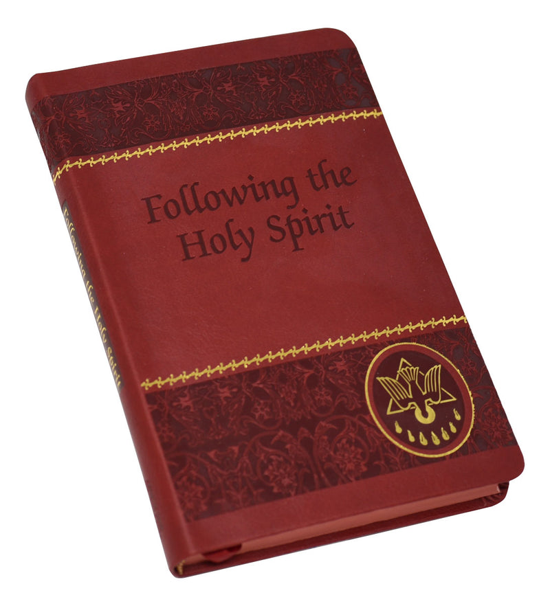 Red and gold foil prayer book on a white background.