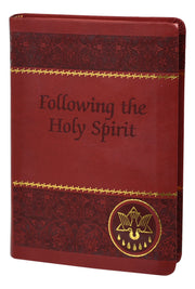 Red and gold foil prayer book on a white background.