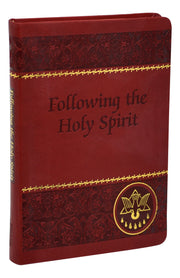 Red and gold foil prayer book on a white background.