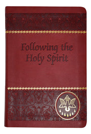 Red and gold foil prayer book on a white background.