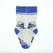 A person in white socks with blue accents and an image of Mother Teresa