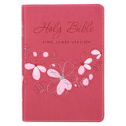 A pink faux leather compact Bible with a floral design and the text 'Holy Bible King James Version' on the cover. The Bible is presented in a flexible cover format with a satin ribbon marker.