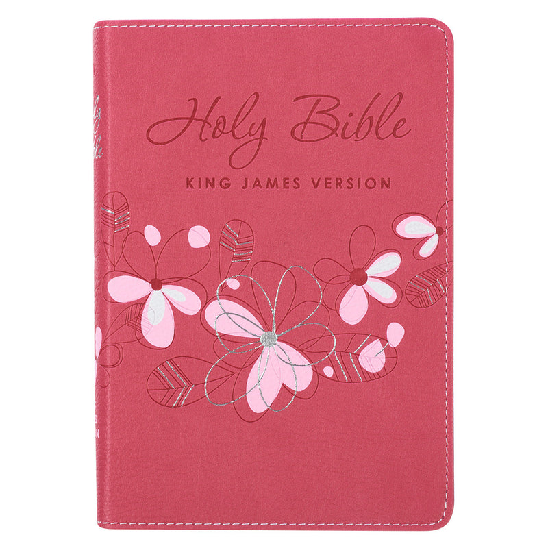 A pink faux leather compact Bible with a floral design and the text 'Holy Bible King James Version' on the cover. The Bible is presented in a flexible cover format with a satin ribbon marker.