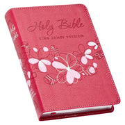 Pink Bible with floral designs and 'Holy Bible King James Version' text on a white background