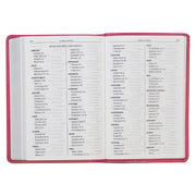 Pink Bible on a white background