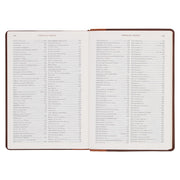 A two-tone espresso and toffee brown faux leather Bible on a white background.