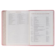 A pink faux leather Bible won a white background.