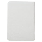 A white faux leather compact Bible with a quatrefoil floral design.