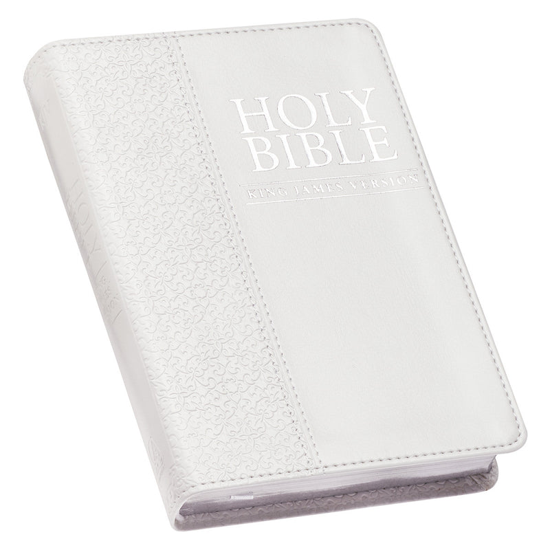 A white faux leather compact Bible with the text 'Holy Bible King James Version' debossed on the cover, featuring a quatrefoil floral design and a silver foiled title.