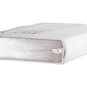A white faux leather compact Bible with the text 'Holy Bible King James Version' debossed on the cover, featuring a quatrefoil floral design and a silver foiled title.