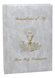 White book titled 'Remembrance of My First Holy Communion' on a white background